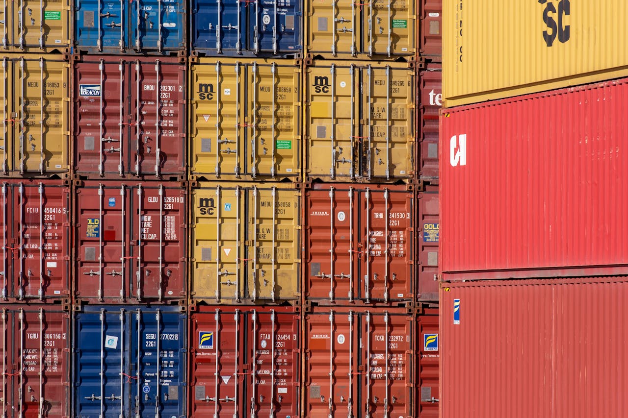 services-img Colorful shipping containers stacked in a port for transport logistics.